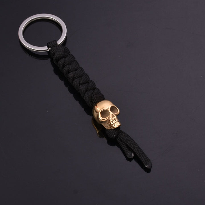 WorldNorse Totenkopf Fallschirmseil Schlüsselanhänger - Gold - image 1